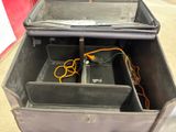an open suitcase with a pair of scissors in it