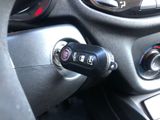 a close up of a car key in the center of the steering wheel