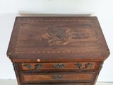 a small wooden table with a drawer on top of it