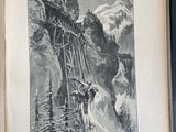 an open book with a picture of a train going over a bridge
