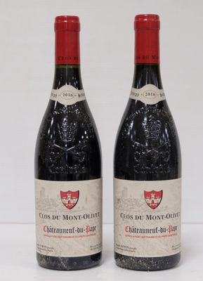 two bottles of red wine sitting next to each other on a table