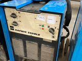 a blue machine that is sitting on the ground