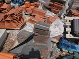 a pile of bricks and other items on the ground