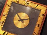 a clock with roman numerals on the face of it