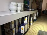 a shelf with bowls and bowls on it in a store