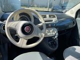 a steering wheel and dashboard of a small car