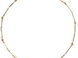 a gold chain necklace with small beads on a white background