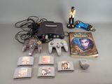 a video game console and several game cards on the table