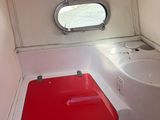 a small bathroom with a sink and a mirror on the wall