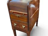 an image of a wooden desk with drawers on it