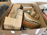 a cardboard box filled with many different types of items