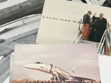 a lot of old photos of men standing on a plane