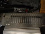 a close up of a sound board with a bag on top of it