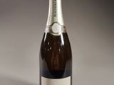 a close up of a bottle of champagne on a table