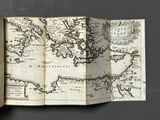 an open book with a map of the world on it
