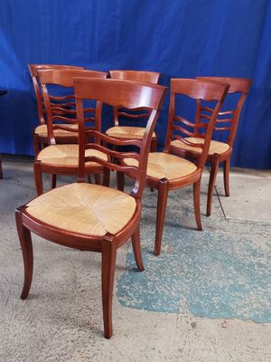 Suite de 6 chaises paillées en merisier.