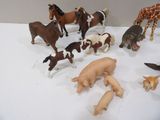 a lot of toy animals that are on a table