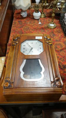 a clock sitting on a table in a room