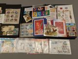 a lot of stamps and postcards on the table
