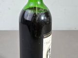 a bottle of wine that is sitting on a table