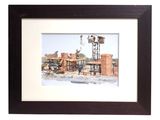 framed picture of a picture of a town with a windmill in the background