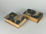 two books that are sitting next to each other on a table