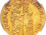 a gold coin with an image of a man holding a sword