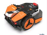 an image of a robotic lawn mower on a white surface
