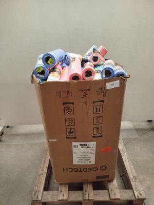 a cardboard box full of assorted items sitting on a pallet