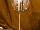a lamp that is sitting on a table next to a bag