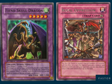 a close up of two cards of a game