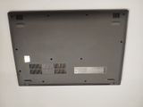 a close up of a laptop on a white surface