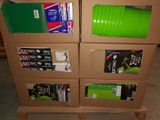 a stack of cardboard boxes with a green cup on top of it