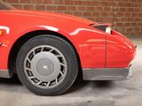 an image of a red car parked in a garage