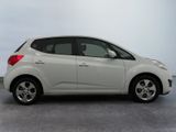 a white car that is parked in a parking lot