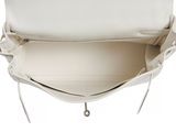 the inside of a white purse with a zipper on it