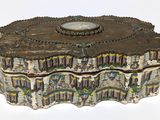 a decorative box with a clock on top of it