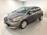 a grey car is parked in a white room