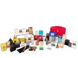 many different types of perfumes in a red box
