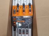 a box full of tools sitting on top of a cardboard box