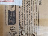 a cardboard box with a label on it sitting on a table