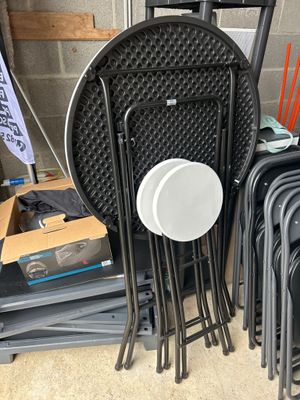 a stack of chairs and a table with a frisbee on it