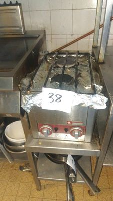an image of a commercial kitchen with a stove and sink