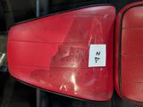 a red seat in the back of a car with a sticker on it