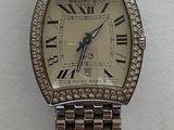 an image of a wrist watch on display with a price tag
