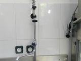 a kitchen sink with a faucet and a faucet in it