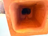 a small hole in the middle of a brick wall