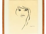 un dessin représentant le visage d'une femme, dans un cadre en bois