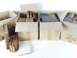 several cardboard boxes are stacked on top of each other on a white surface