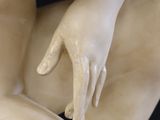 a statue of a man holding a woman ' s hand